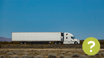A white semi-truck, possibly heading to a small-business shipping hub, drives along a barren road in the desert landscape under a clear blue sky. A green circle with a question mark is overlaid on the bottom right corner of the image.