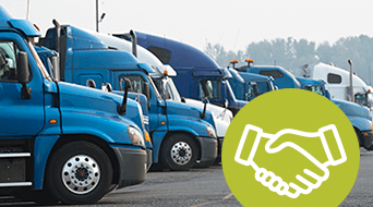 A row of parked blue semi-trucks is seen in a lot, forming a small-business-shipping-hub. In the foreground, a green circle with a white handshake icon suggests a partnership or agreement related to trucking or logistics.