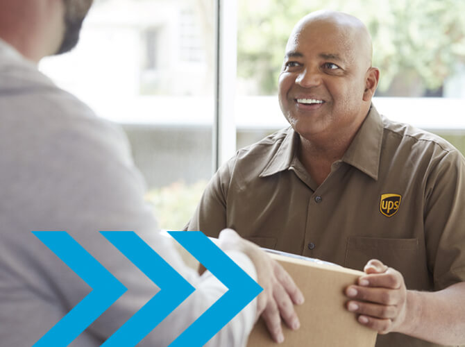 A smiling UPS delivery person in a brown uniform hands a package to a customer. They are standing indoors, near a window with blurred greenery outside. Light blue arrows and a faint white graphic are overlaid on the image.
