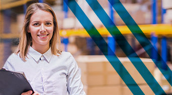 A person with long hair and a white shirt smiles while holding a clipboard, embodying the bustling energy of a small-business-shipping-hub. They stand in a warehouse with shelves stacked with boxes in the background, as diagonal blue stripes partially overlay the image.