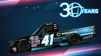 Racing truck with number 41 and Worldwide Express branding, featuring a black and blue design. A 30 Years logo is in the top right corner. The background is a gradient with diagonal lines.