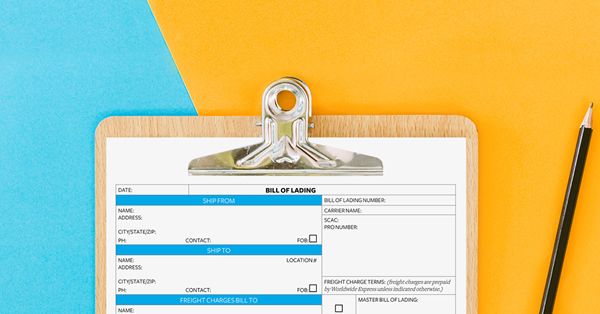 A clipboard with a bill of lading on it is placed against a split blue and orange background. A pencil lies to the right of the clipboard.