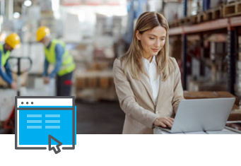 A woman in a beige blazer works diligently on her laptop in a bustling warehouse, managing logistics with SpeedShip. In the background, two workers don safety vests and helmets, efficiently coordinating tasks. An icon of a web page with a cursor appears prominently in the foreground.